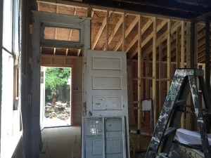 The kitchen door leading to the laundry room and then to the back deck. 