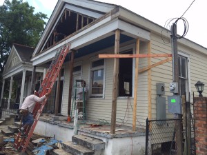 The lower half of the front is put back together. Now they are opening up the attic area to reframe for the attic windows. 