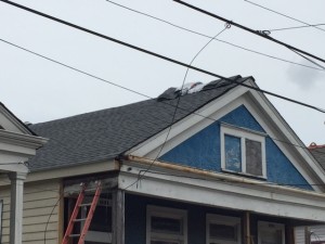 Siding is finished. Got half of the roof done. Then the rain came. 